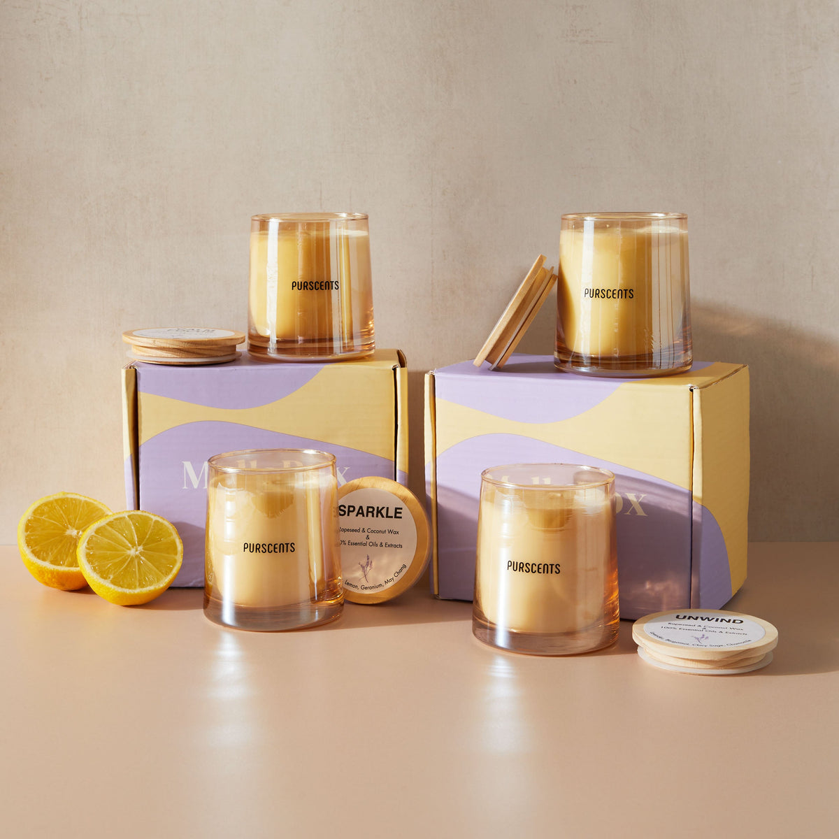 Soy wax essential oil candles displayed on gift boxes